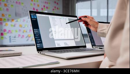 Senior Accountant Manages Tax Statements On Laptop Computer In City. Stock Photo