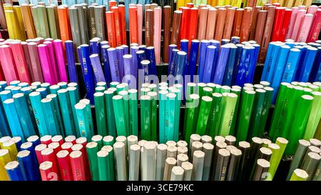 A vibrant display of a large collection of colored pencils, showcasing a wide spectrum of colors arranged in a captivating pattern. Stock Photo