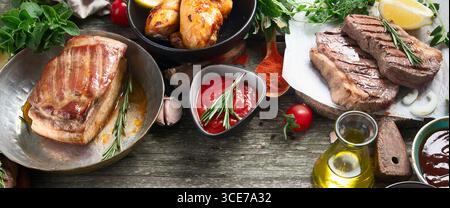 Different types of Grilled meat  on rustic wooden table.Panorama, banner Stock Photo
