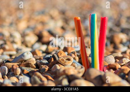 Sticks of Brighton Rock standing on the pebbly beach of Brighton, Brighton, England, UK. Stock Photo