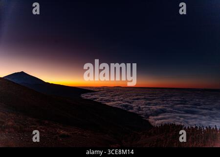Dusk over Mount Teide volcano and the north coast of Tenerife Stock Photo