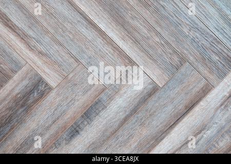 Wooden floor with a checkered pattern. The checkered pattern is made up of many small squares, creating a visually interesting and unique design. The Stock Photo