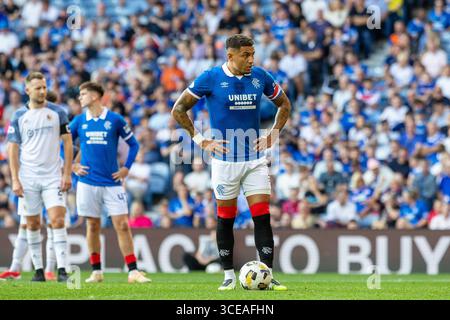 16 August 2025. Glasgow, UK. Rangers played Alloa Athletic at Ibrox Stadium, Glasgow, in the Premier Sports Cup. The final score was Rangers 4 - 2 Alloa Athletic.James Tavernier (R2) waits for the referee's instructions before taking the penalty in 67 minutes, and scoring Rangers 3rd goal. Credit: Findlay / Alamy Live News Stock Photo