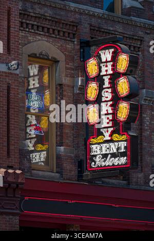 Neon sign for Whiskey Bent Saloon on lower Broadway renowned entertainment district with many bars, restaurants and entertainment venues for live musi Stock Photo