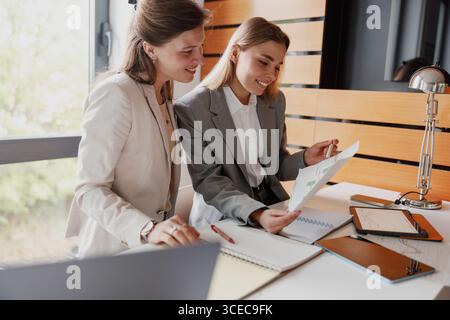 Engaging in a Collaborative Business Meeting within a Modern and Innovative Office Setting Stock Photo