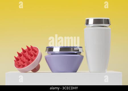 Mockups of premium hair care products on a LED on a yellow background. Shampoo and hair mask. Stock Photo