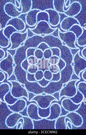 Vivid blue kaleidoscopic design with intricate glowing patterns and repetitive symmetry. Abstract geometric shapes create a mesmerizing visual effect, Stock Photo