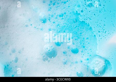 A close-up view of blue foam showcases detailed bubbles and textures. The image highlights the intricate patterns and vibrant color of the foam, ideal Stock Photo