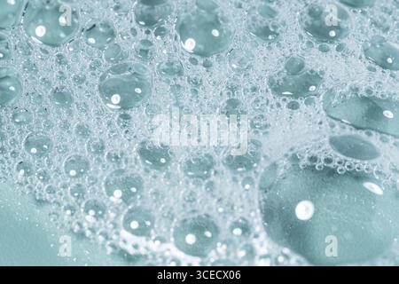 Top view of transparent gel bubbles forming intricate patterns on a laboratory glass surface. The delicate bubbles create a mesmerizing texture agains Stock Photo