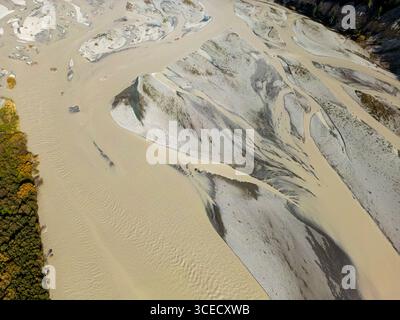 Aerial view of the braided river landscape in the Canterbury region, New Zealand. The intertwining water channels and sandy banks reflect the region's Stock Photo