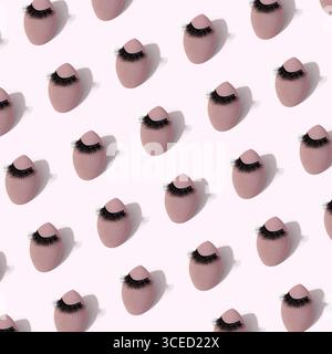 A seamless pattern featuring makeup sponges adorned with false eyelashes set against a soft background, emphasizing beauty and cosmetic tools in a sty Stock Photo