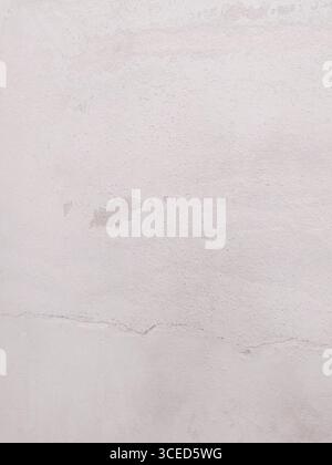 Subtle texture in neutral tones. A faded and slightly cracked wall for backgrounds, overlays, and visual metaphors of time, decay, or aging. Use in de Stock Photo