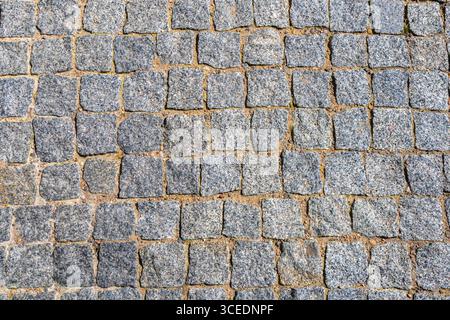 Cobblestone street, view from above. Beautiful background. Stone pavement texture. Stock Photo
