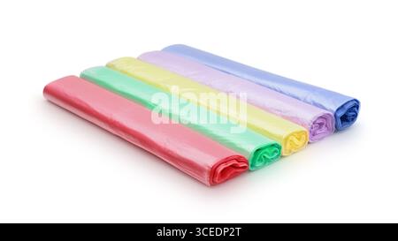 Several multi-colored rolls of plastic bags isolated on white. Stock Photo