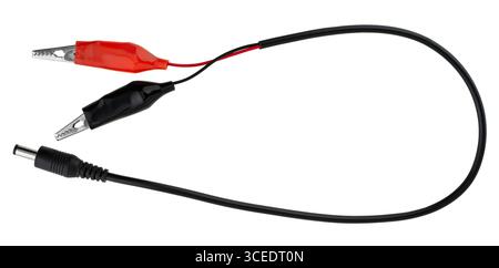 Insulated wire with crocodile clips at the ends and a connector, on a white background in insulation. Stock Photo