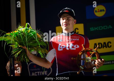 Belgian Arnaud De Lie of Lotto Cycling Team celebrates after winning