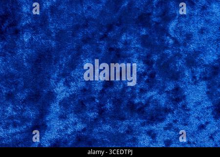 Abstract background blue velvet fabric with pattern of lines and spots Stock Photo
