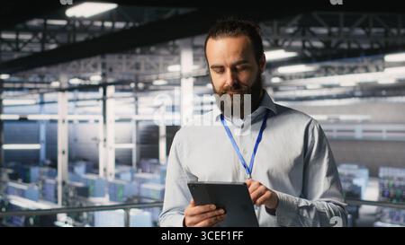 Computer scientists in data center monitoring neural network LLM visualization. Industrial server farm IT professionals overseeing rigs powering machine learning processes Stock Photo