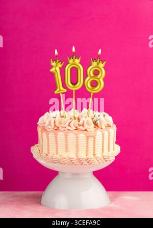 Birthday cake with candle number 108 - Blue background Stock Photo - Alamy