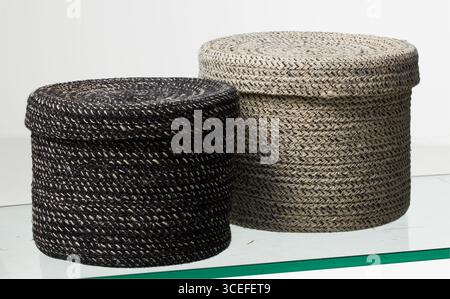 Two round woven laundry baskets solated nature background with clipping path Stock Photo