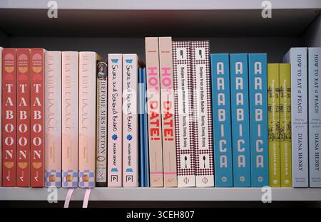 arab and italian cook books on shelf in book shop, norfolk, england Stock Photo