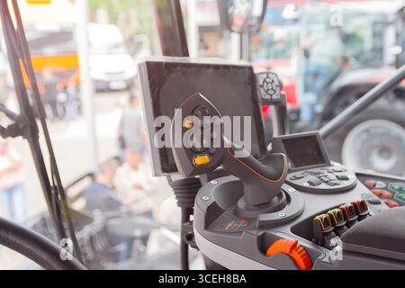 The cabin and control stick tractor of a modern tractor close-up. Industry Stock Photo