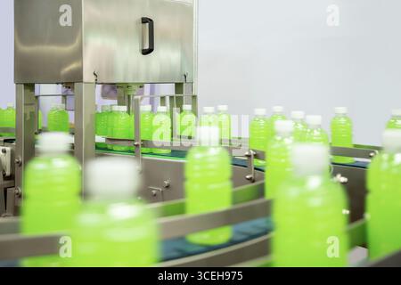 Line for the production and bottle of juice or water. Conveyor of food industry. Stock Photo