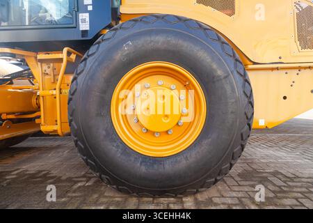 Frontal bulldozer loader. Yellow excavator close up. Stock Photo