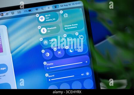 Poznan, Poland - August 15, 2025: Modern macOS 26 control center on liquid glass, providing seamless management for smart home devices, display, and s Stock Photo