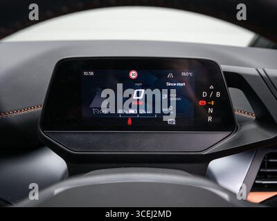 Derby, UK - August 18 2025: digital instrument cluster in a modern car, featuring a high-resolution display with speed, navigation, and driving data p Stock Photo