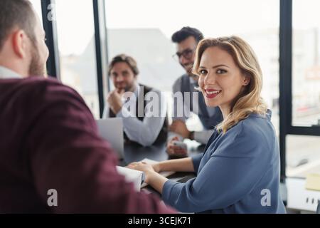 Group of coworkers discussing project strategy. Stock Photo
