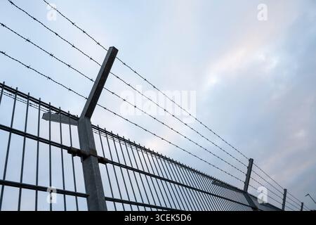 Barbed wire fence Stock Photo