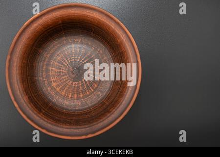 Clay bowl isolated on black background Stock Photo