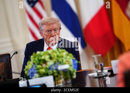 Washington DC, USA. 18th Aug, 2025. United States President Donald J Trump participates in a Multilateral Meeting with European Leaders in the East Room of the White House in Washington, DC, USA, on Monday, August 18, 2025. The European Leaders are at the White House in support of President Zelenskyy following President Trump's meeting with President Vladimir Putin of Russia in Anchorage, Alaska, USA, on Friday, August 15, 2025.Credit: Aaron Schwartz/Pool via CNP /MediaPunch Credit: MediaPunch Inc/Alamy Live News Stock Photo