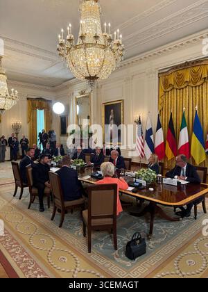 Washington, United States. 18th Aug, 2025. U.S President Donald Trump, center right, holds a multilateral meeting with Ukrainian President Volodymyr Zelenskyy, and European leaders at the East Room of the White House, August 18, 2025 in Washington, DC The meeting discussed the recent US-Russia Summit and possible peace agreements to end the Russian-Ukrainian war. Credit: Margo Martin/White House Photo/Alamy Live News Stock Photo