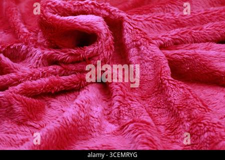 Overlay of red fiber cloth texture. Close-up view. Stock Photo