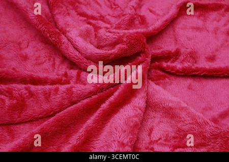 Overlay of red fiber cloth texture. Close-up view. Stock Photo