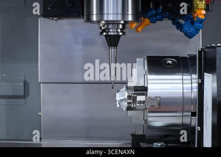 Close-up drilling and polishing on inside CNC Machine for metalwork on smart factory, industry 4.0 Stock Photo