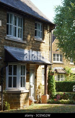 Charming English Stone House with Garden in Summer Afternoon Light. Adderbury, England Stock Photo
