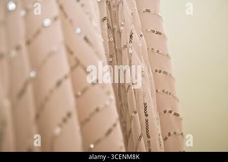 Pink sheer fabric with sequins Stock Photo
