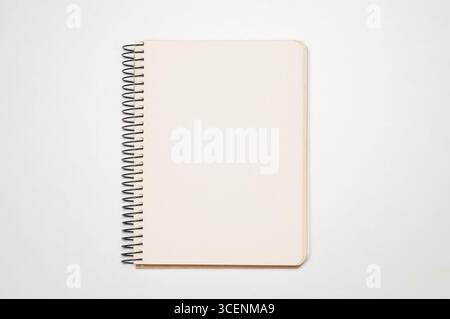 Blank notebook or sketchbook with ring spine on white background Stock Photo