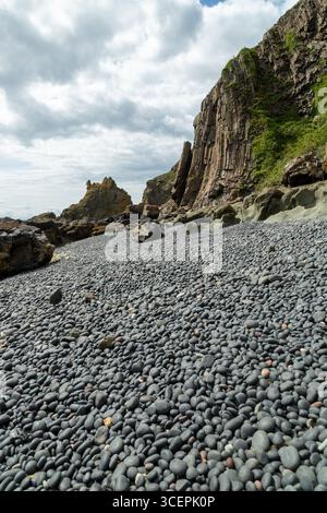A pebble beach between the sections of chain on the Earlsferry Elie chain walk. Stock Photo