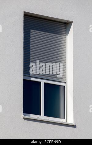 Electric roller shutter on a new residential building Stock Photo