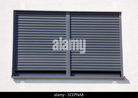 Electric roller shutter on a new residential building Stock Photo