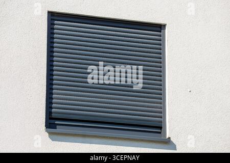 Electric roller shutter on a new residential building Stock Photo