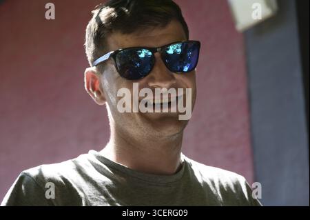 Portrait of a smiling young man with sunglasses, Baden-Wuerttemberg, Germany Stock Photo