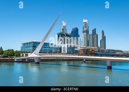 Puerto Madero and Womans Bridge under a Clear Blue Sky in Buenos Aires, Argentina. Stock Photo