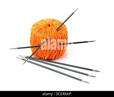 Orange yarn and knitting needles ready for creating warm clothes or accessories, isolated on white Stock Photo