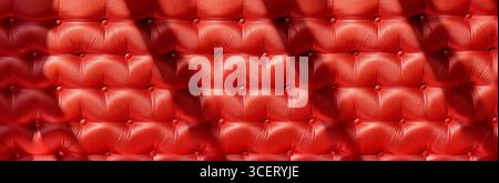 Red upholstery background creating a luxurious, elegant and classic pattern, ideal for interior design projects Stock Photo