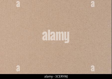 Beige color cardboard paper surface macro close up view Stock Photo